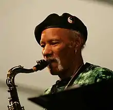 Neville playing sax at Jazz Fest, 2011