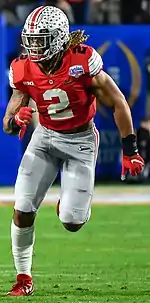 A man during a game playing for Ohio State University's football team.