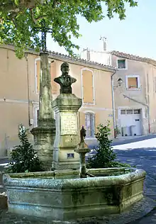 Fountain in Châteauneuf-de-Gadagne, with a bust of native Alphonse Tavan, one of the co-founders of the Félibrige.