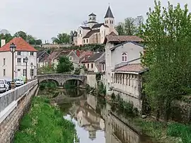 The Pertuis-au-Loup bridge over the River Seine and the church