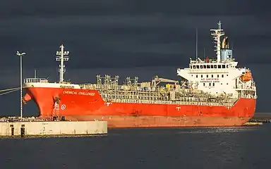 Chemical Challeger moored in the harbour of Sète, Hérault, France. A ship is a large watercraft that travels the world's oceans and other sufficiently deep waterways.