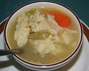 A bowl of chicken and dumplings