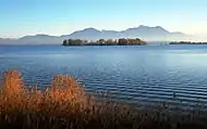 Krautinsel with (right) a small part of the Herreninsel island and in the background the Chiemgau Alps