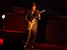 Foreman performing live with Madness at Manchester Arena, in 2014