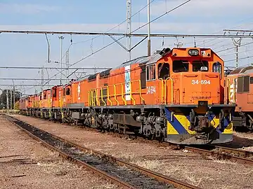 No. 34-694 in Spoornet orange with NLPI LOG emblems, Capital Park, 10 May 2013