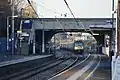 A passing service operated by East Midlands Railway approaching platform 3 from the north