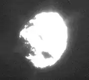 An overexposed image of Wild 2 showing plumes of material coming from the surface