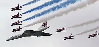 Image 13Concorde (and the Red Arrows with their trail of red, white and blue smoke) mark the Queen's Golden Jubilee. With its slender delta wings Concorde won the public vote for best British design. (from Culture of the United Kingdom)