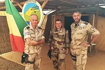 Camouflage Daguet worn by a French officer, middle, during Operation Barkhane in 2016.