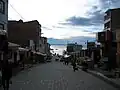 Shopping street with Lake Titicaca in the background.