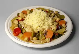 Image 8Couscous (Arabic: كسكس) with vegetables and chickpeas, the national dish of Algeria (from Culture of Algeria)