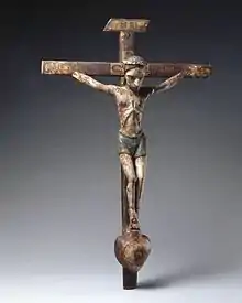 Image 33José Rafael Aragón, Crucifix, ca. 1795–1862, Brooklyn Museum, From about 1750, Catholic churches in Spanish New Mexico were increasingly decorated with the work of native craftspeople rather than with paintings, sculpture, and furniture imported from Europe. This small santo (religious image) is typical of the locally produced objects. It is made of indigenous pine and painted with water-based pigments used by native artisans. (from History of New Mexico)