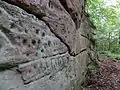 It is unusual to find these glyphs on a vertical rock face.