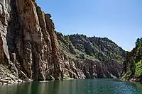 River below a steep rocky cliff