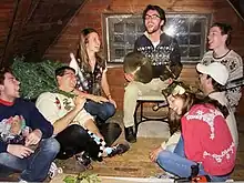 The University of Nebraska Lincoln cymbal players celebrating a holiday party in the attic.