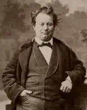 photograph of plump, white, clean shaven man in 19th century clothes