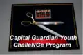 The scissors and ribbon from the ground breaking ceremony to commemorate the land dedicated to the DCNG Capital Guardian Youth Challenge Program.