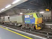 A blue and grey maintenance vehicle stands at James Street underground station