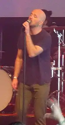 A man singing into a microphone