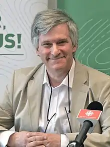 Green speaking at a press conference in 2015.