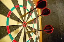 Darts in a bullseye target