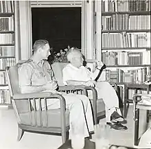 Reid sitting alongside Israeli prime minister David Ben Gurion. 1960, Boris Carmi, Meitar collection, National Library of Israel