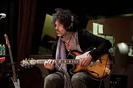 Doyle Bramhall II played acoustic and electric guitar.