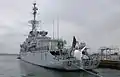 Aft of the frigate De Grasse; the towed sonar is clearly visible