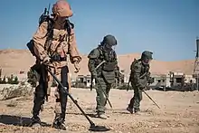 Russian sappers in Palmyra, Syria. Soldier on the left is wearing the desert variant of EMR camouflage