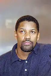 Denzel Washington in a blue shirt.