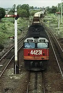 44231 on a northbound freight train arriving at Casino in 1987