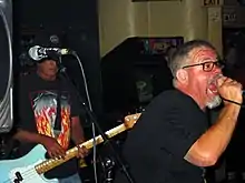 Dicks performing in Austin, Texas in 2005; pictured left to right: Buxf Parrott and Gary Floyd