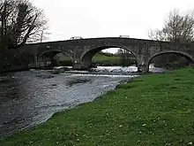 the river flowing under a bridge