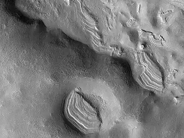 Several sets of dipping layers  This image was named HiRISE picture of the day.