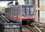 B92 stock train 57 arrives at Canary Wharf DLR station