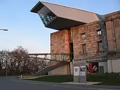 Documentation Center; with its "glass and steel arrow", piercing the north wing, the Documentation Center is supposed to be a widely visible architectural counterpoint.