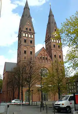 A red brick building, with two towers