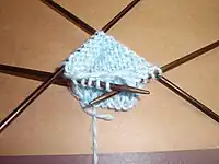 Unlike crochet, knitting requires specialized needles to create circular rounds.