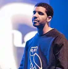 An image of Drake performing on stage.