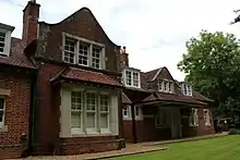 Brick house next to a brick station.