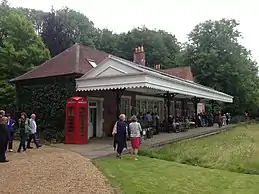 Two railway platforms with the space between them filled in and planted as a lawn