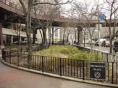 Drumgoole Plaza by Pace University and an overpass.