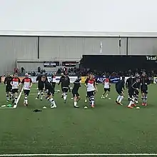 Photo of Dundalk F.C. 2019 squad warm-up before a match in Oriel Park