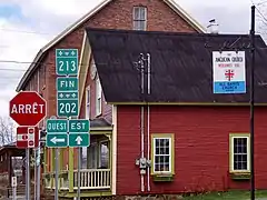 Junction with route 213 in Dunham.