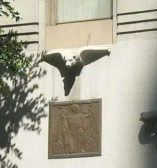 Decorations above entrance to E.F. Hutton Building at #623