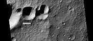 Group of craters that may have struck the surface at the same time after an asteroid broke up.  If the craters were formed at different times, they would have wiped away parts of the others.  Picture was taken by HiRISE, under HiWish program.  Image located in Terra Cimmeria.