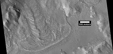 Glacier coming out of valley, as seen by HiRISE under HiWish program Location is rim of Moreux Crater.