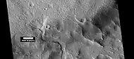 Channel that has cut through a crater rim, as seen by HiRISE under HiWish program