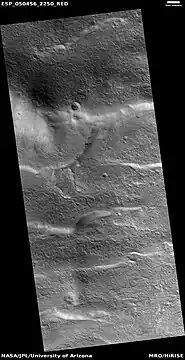 Wide view of surface with spots displaying mantle, as seen by HiRISE under HiWish program  Location is the Arcadia quadrangle.