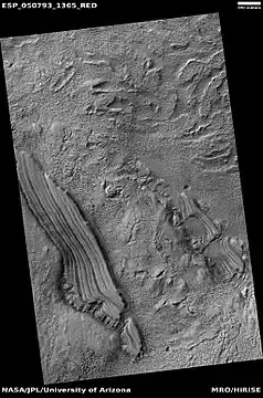 Tilted layers, as seen by HiRISE under HiWish program  Location is Hellas quadrangle.